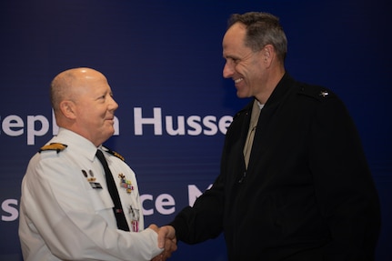 On behalf of the Secretary of the Navy, AUKUS Integration & Acquisition Director Rear Adm. Lincoln Reifsteck, right, presented Royal Australian Navy Capt. Stephen Hussey with a Meritorious Service Award and medal during a Dec. 13, 2024