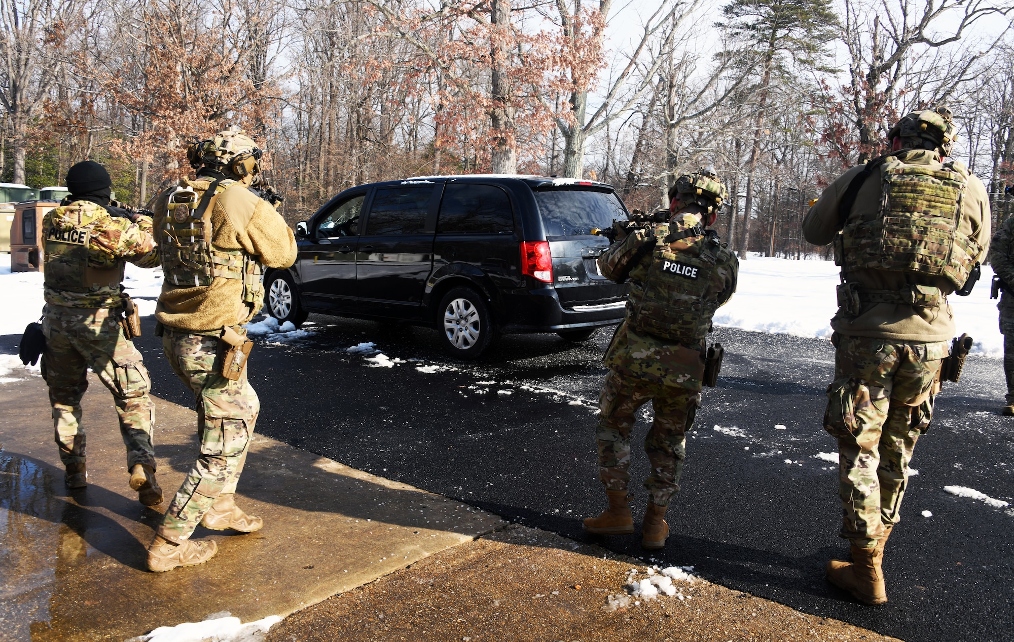 Defenders from the 459th Security Forces Squadron conduct "Critical Skills Training” (CST) series, Jan. 11, 2025, at Joint Base Andrews, Md. This iteration provided repetitions in vehicle interdiction/high risk traffic stops, patrolling with degraded tactical communications, and an overview of Grey Zone Warfare. CST prepares Defenders to operate at contingency locations in a near-peer fight scenario. (U.S. Air Force photo by Tech. Sgt. Cierra Mason)