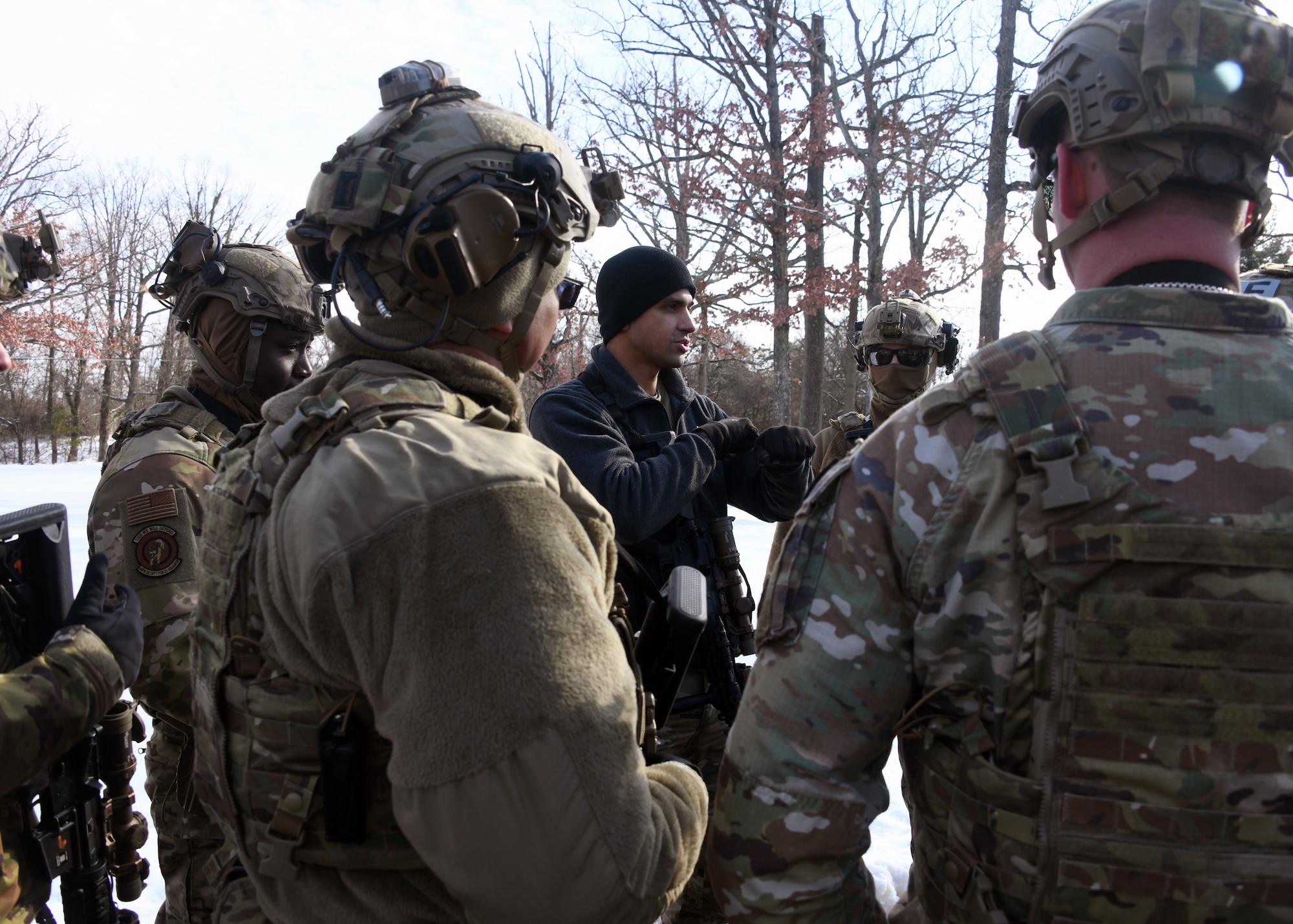 Defenders from the 459th Security Forces Squadron conduct "Critical Skills Training” (CST) series, Jan. 11, 2025, at Joint Base Andrews, Md. This iteration provided repetitions in vehicle interdiction/high risk traffic stops, patrolling with degraded tactical communications, and an overview of Grey Zone Warfare. CST prepares Defenders to operate at contingency locations in a near-peer fight scenario. (U.S. Air Force photo by Tech. Sgt. Cierra Mason)