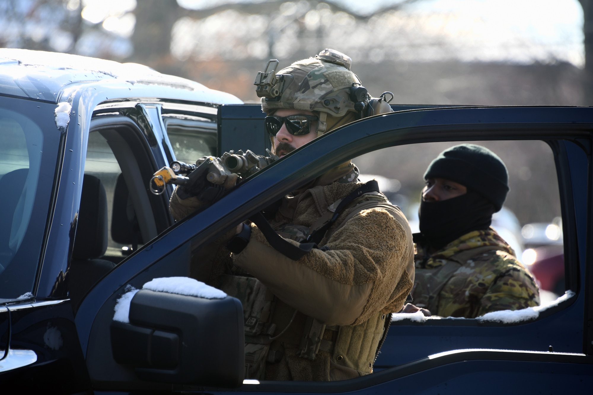 Defenders from the 459th Security Forces Squadron conduct "Critical Skills Training” (CST) series, Jan. 11, 2025, at Joint Base Andrews, Md. This iteration provided repetitions in vehicle interdiction/high risk traffic stops, patrolling with degraded tactical communications, and an overview of Grey Zone Warfare. CST prepares Defenders to operate at contingency locations in a near-peer fight scenario. (U.S. Air Force photo by Tech. Sgt. Cierra Mason)