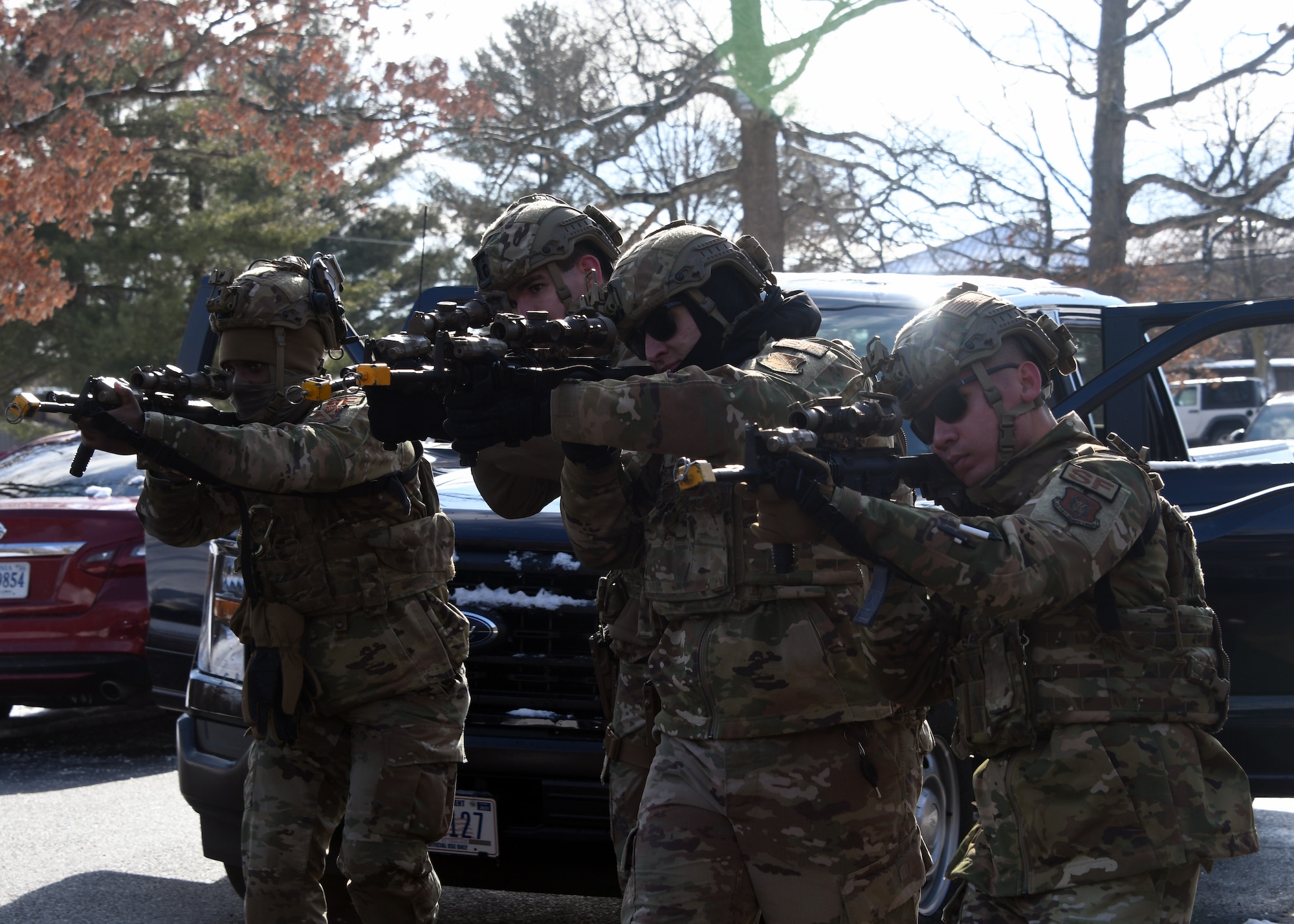 Defenders from the 459th Security Forces Squadron conduct "Critical Skills Training” (CST) series, Jan. 11, 2025, at Joint Base Andrews, Md. This iteration provided repetitions in vehicle interdiction/high risk traffic stops, patrolling with degraded tactical communications, and an overview of Grey Zone Warfare. CST prepares Defenders to operate at contingency locations in a near-peer fight scenario. (U.S. Air Force photo by Tech. Sgt. Cierra Mason)
