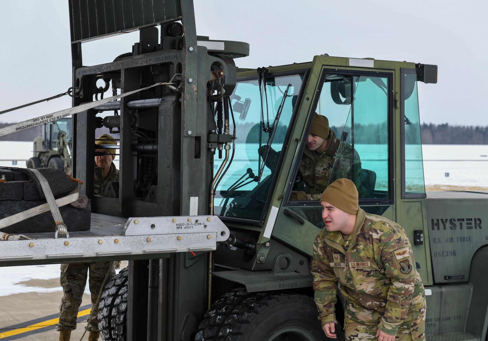 Airmen from the 76th Aerial Port Squadron load an airdrop training pallet onto a C-130J-30 Super Hercules aircraft at Youngstown Air Reserve Station, Ohio, Jan. 14, 2025.