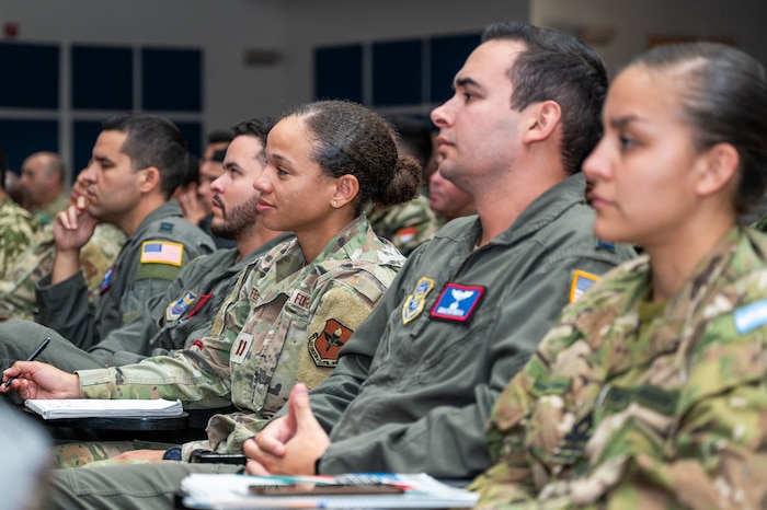 Image of Airmen listening to a presentation.