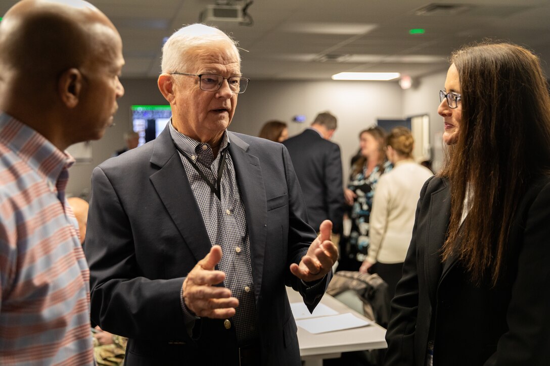 Retired U.S. Army Maj. Gen. Stephen Collins talks with guests at his retirement ceremony at Bluegrass Station in Lexington, Kentucky on Dec. 10, 2025.