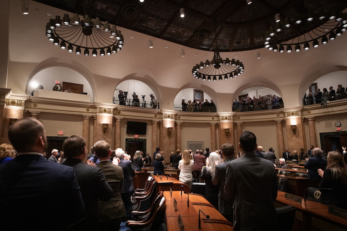 U.S. Army Sgt. Grayson Johnson and Spc. William Price, , located on the top balcony, receives a standing ovation for their service after being recognized by Kentucky Gov. Andy Beshear during the State of the Commonwealth in the Kentucky House Chambers in Frankfort, Kentucky on Jan. 8, 2025.