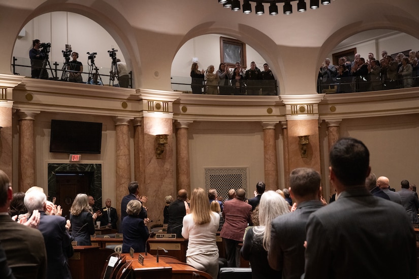 U.S. Army Sgt. Grayson Johnson and Spc. William Price, , located on the top balcony, receives a standing ovation for their service after being recognized by Kentucky Gov. Andy Beshear during the State of the Commonwealth in the Kentucky House Chambers in Frankfort, Kentucky on Jan. 8, 2025.