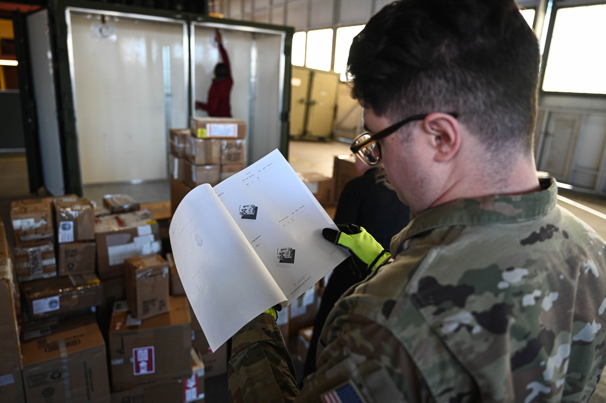 U.S. Space Force Spc. 4 Blake Settoon, 62nd Cyberspace Squadron defensive cyber operator, reviews a build-out list generated by an artificial intelligence tool on Peterson Space Force Base, Colorado, Jan. 15, 2025. This build-out list detailed what Department of Defense cargo was to be packed for future C-130 Hercules deployments. (U.S. Space Force photo by Senior Airman Justin Todd)