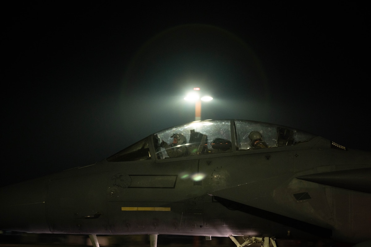 Aircrew in the cockpit of an aircraft.