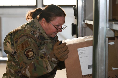 U.S. Air Force Staff Sgt. Marnie Brannen, 302nd Logistics Readiness Squadron materiel management craftsman, loads a box into a military container during the space logistics challenge at Peterson Space Force Base, Colorado, Jan. 15, 2025. As the second round of tests proceeded, Brannen used her skills and knowledge to load the military container as quickly and efficiently as possible. Her results were used to create a baseline for the artificial intelligence later in the day. (U.S. Space Force photo by Staff Sgt. Jaime Sanchez)