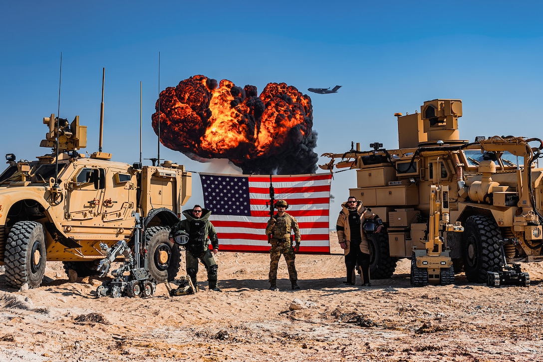 Air Force explosive ordnance disposal technicians assigned to the 379th Expeditionary Civil Engineer Squadron pose for a photo during a controlled demolition within the U.S. Central Command area of responsibility, Jan. 10, 2025.