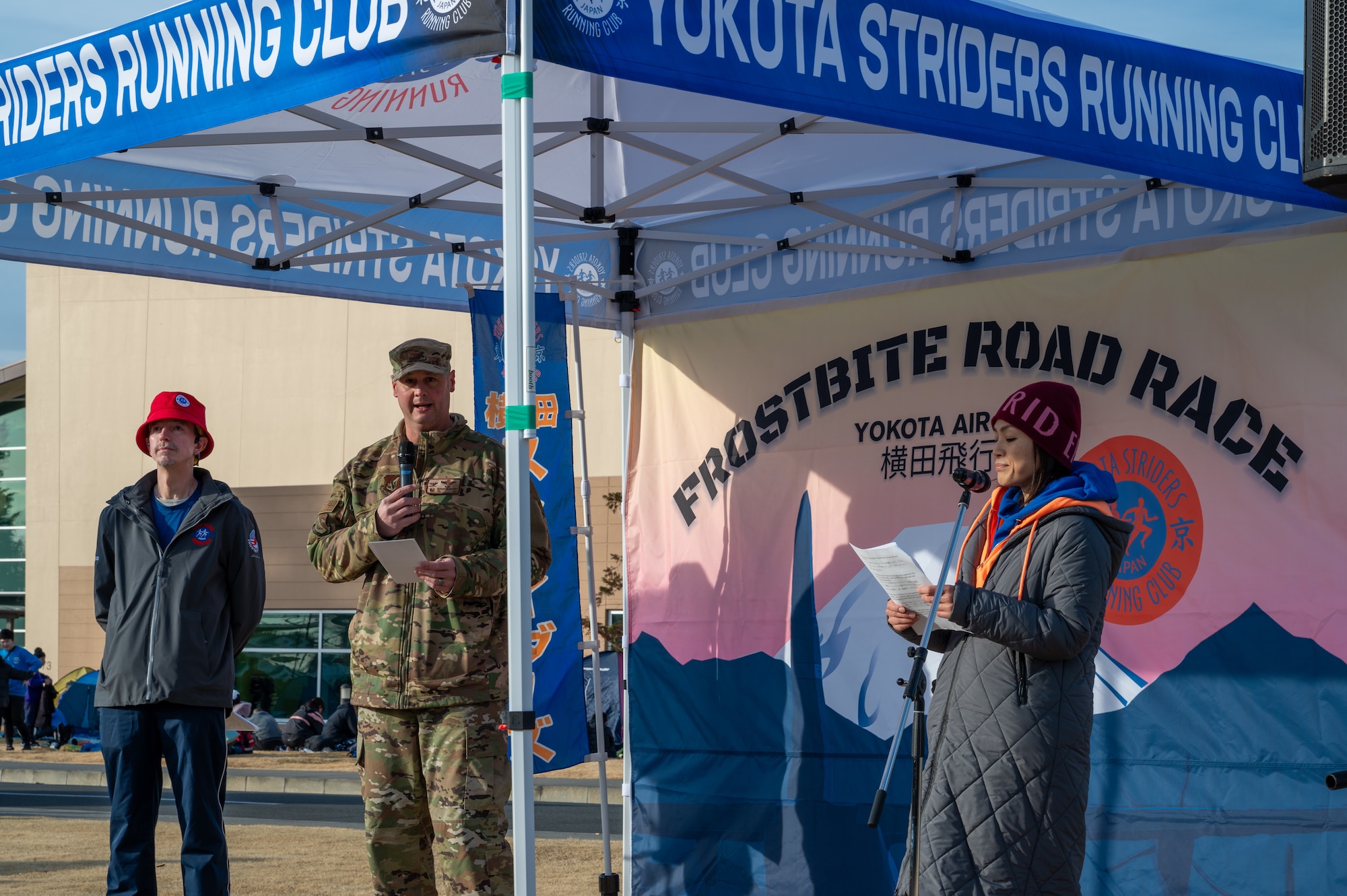 U.S. Air Force Col. Richard McElhaney, 374th Airlift Wing commander, speaks to attendees before the start of the 44th Annual Frostbite Road Race at Yokota Air Base, Japan.