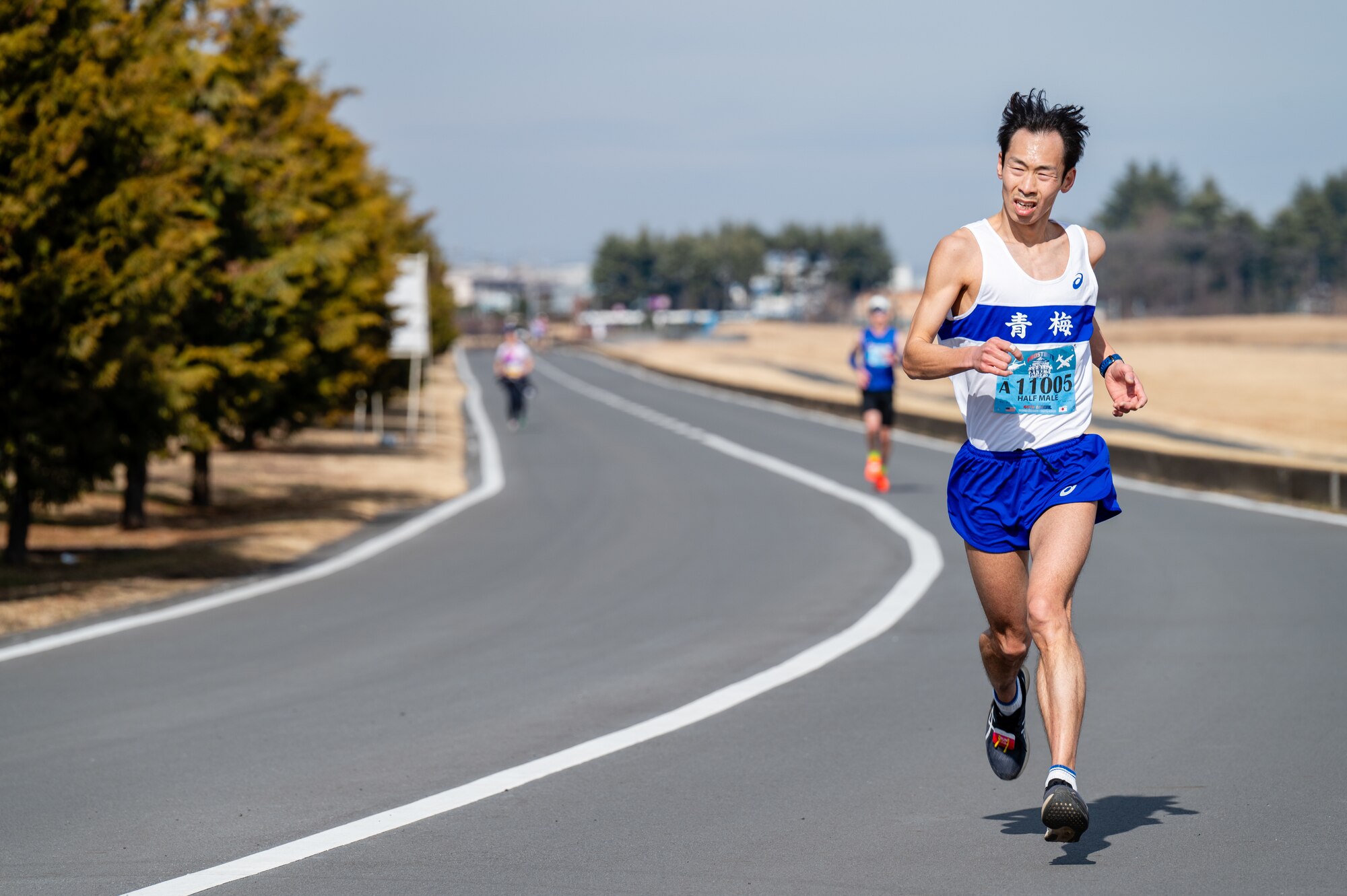 A runner competes in the half marathon during the 44th Annual Frostbite Road Race at Yokota Air Base, Japan.