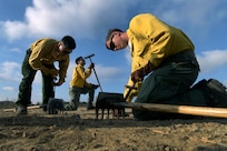 U.S. Army Sgt. Bryce Carter, an infantryman with C Company, 1st Battalion, 160th Infantry Regiment, California Army National Guard, sharpens the blade of a hoe to clear brush and other debris as part of remediation efforts along the Mulholland Trail near Tarzana, California, in the aftermath of the Palisades Fire, Jan. 18, 2025. Carter and other members of his unit were assisting CALFIRE in mop-up efforts, which included clearing brush and backfilling firebreaks and other areas to prevent mudslides and reduce the impact of firefighting efforts.