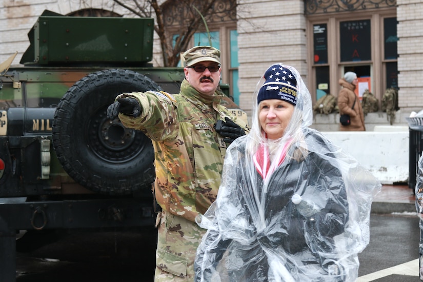 U.S. Army Staff Sgt. Brett Lefever, assigned to Headquarters Support Company, 55th Maneuver Enhancement Brigade, Pennsylvania Army National Guard, assists civil authorities by directing foot traffic in Washington, D.C. in support of the 60th Presidential Inauguration Jan. 19, 2025. Approximately 8,000 National Guard service members from approximately 40 states and territories comprise JTF-DC to support the 60th Presidential Inauguration, continuing a legacy that began in 1789 when their predecessors escorted George Washington to the first inauguration. At the request of civil authorities, these National Guard service members provide critical support such as crowd management, traffic control points, CBRN response, civil disturbance response and sustainment operations. Their expertise and seamless collaboration with interagency partners help ensure a safe and peaceful transition of power during this historic event. (U.S. Army National Guard photo by Sgt. 1st Class Shane Smith)