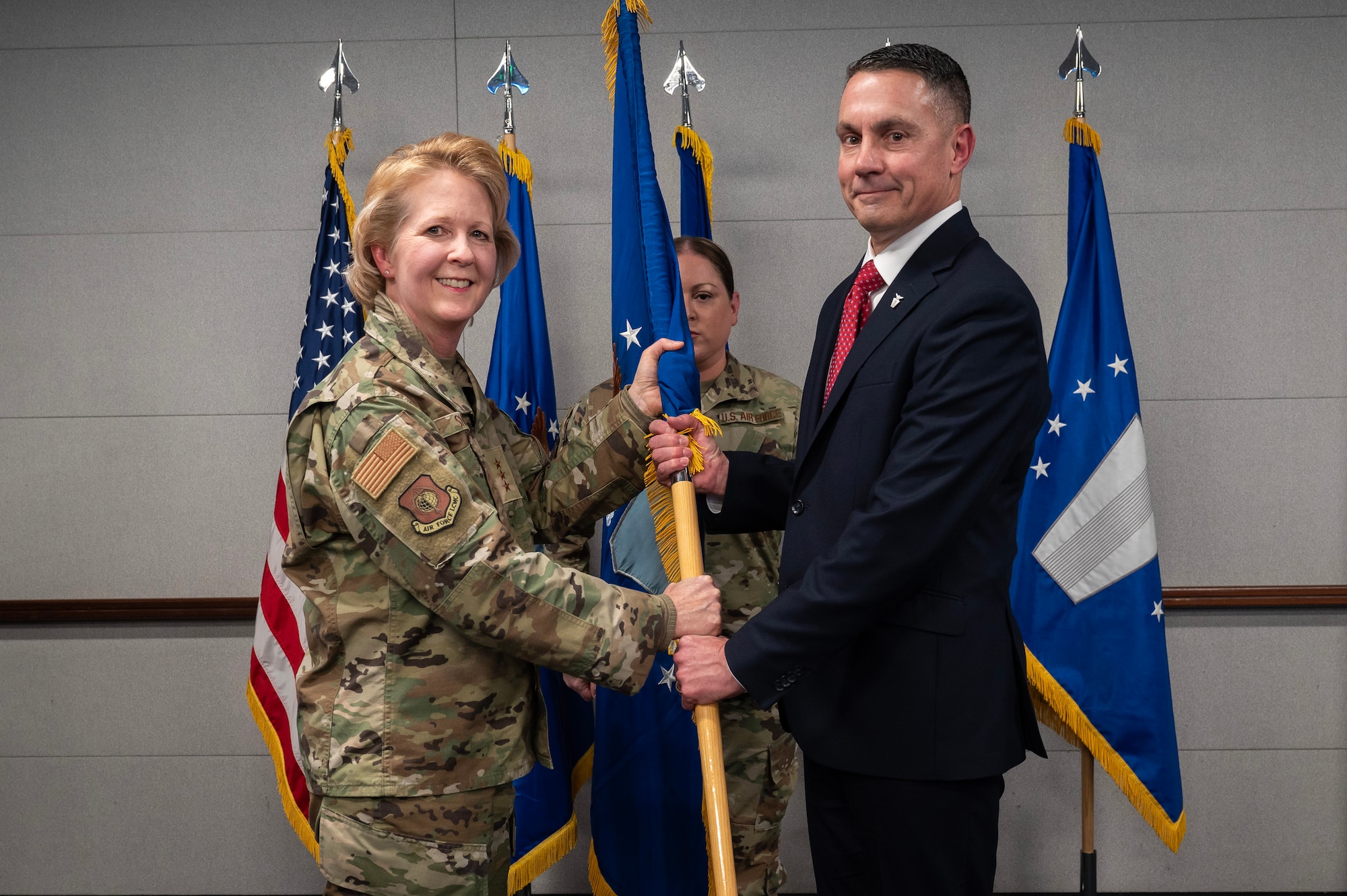 Lt. Gen. Donna Shipton, Air Force Life Cycle managemenet Center, Commander, presented the newly established Training Directorate standard to Rodney Stevens during an Assumption of Leadership Ceremony on Wright-Patterson Air Force Base, Ohio, Jan. 15, 2025. Stevens is the Training Directorate's first Director and Program Executive Officer. The directorate was formed to house all Air Force training acquisition activities under one focused organization.   (U.S. Air Force photo by Jim Varhegyi)