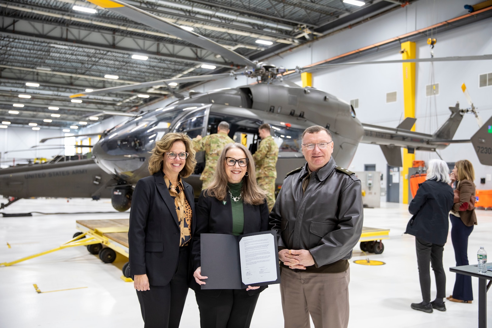 U.S. Army Maj. Gen. Gregory Knight, Vermont Adjutant General, Vermont National Guard, poses for photo with Vermont secretary of the Agency of Commerce and Community Development, Lindsay Kurrle (left) and Dr. Bettyjo Bouchey, UVM Chief Officer for Professional and Continuing Education at the Army Aviation Support Facility.