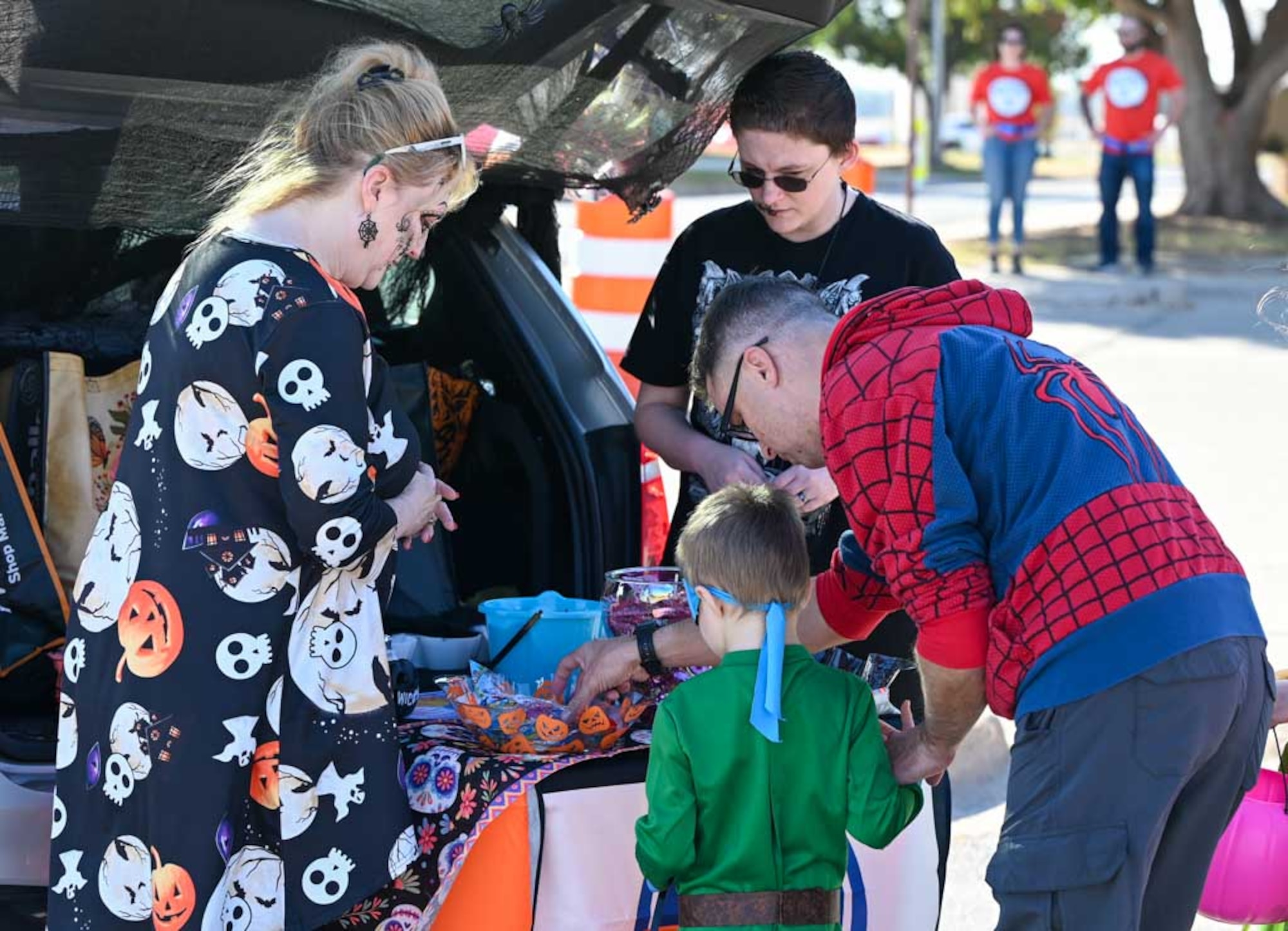 Families stop by a festive Trunk-or-Treat station during the 552nd Air Control Wing’s Boo Bash at Tinker Air Force Base. The event brought together Airmen, volunteers, and families for a safe and fun-filled Halloween celebration.
(U.S. Air Force photo by Garrett N. Cole)