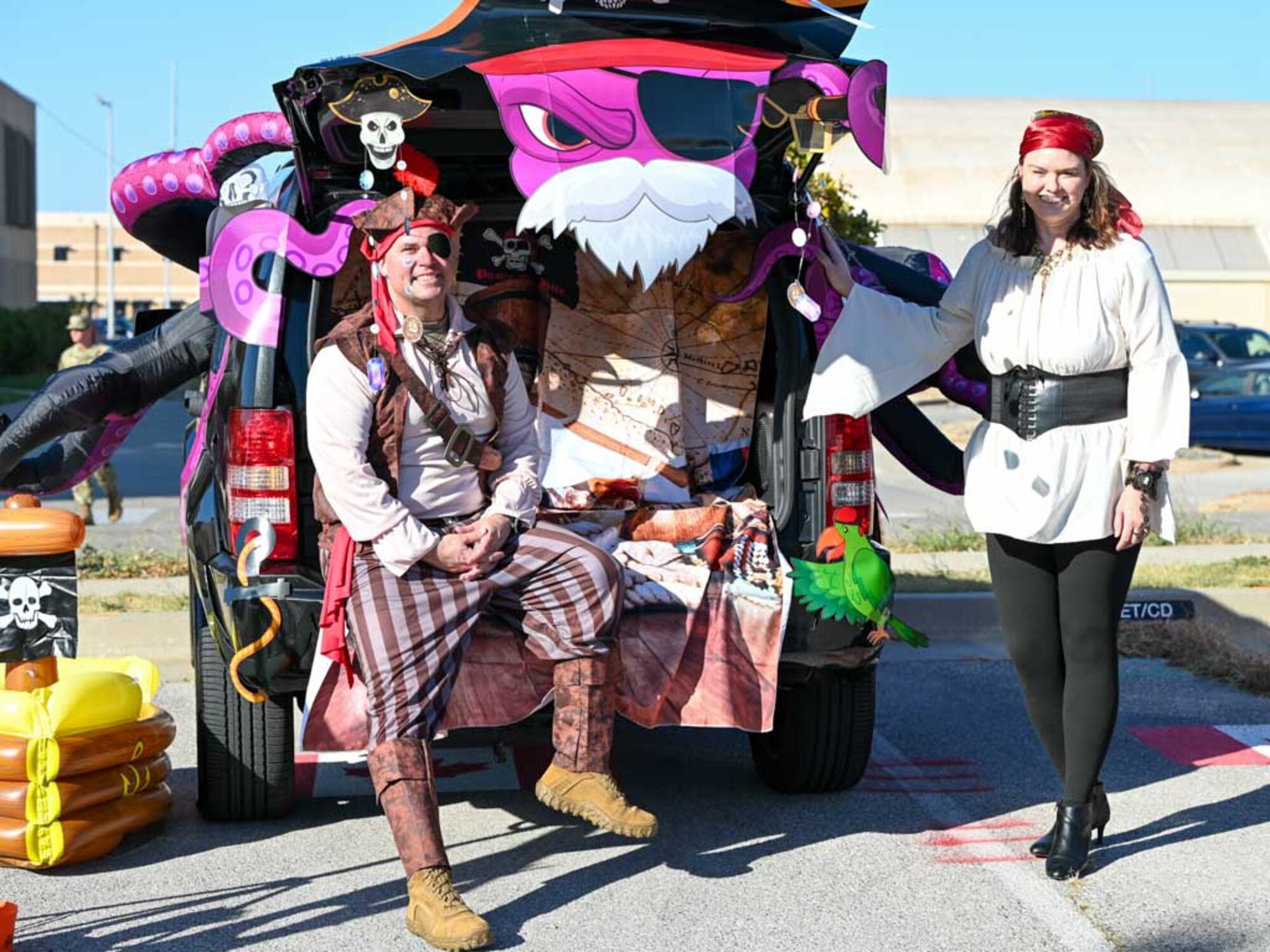 Col. James Combs, 552nd Air Control Wing deputy commander, and his wife, Cara, pose with their pirate-themed Trunk-or-Treat station during the Boo Bash at Tinker Air Force Base. Their creative setup was a highlight of the event, bringing joy to children and families celebrating Halloween.
(U.S. Air Force photo by Garrett N. Cole)