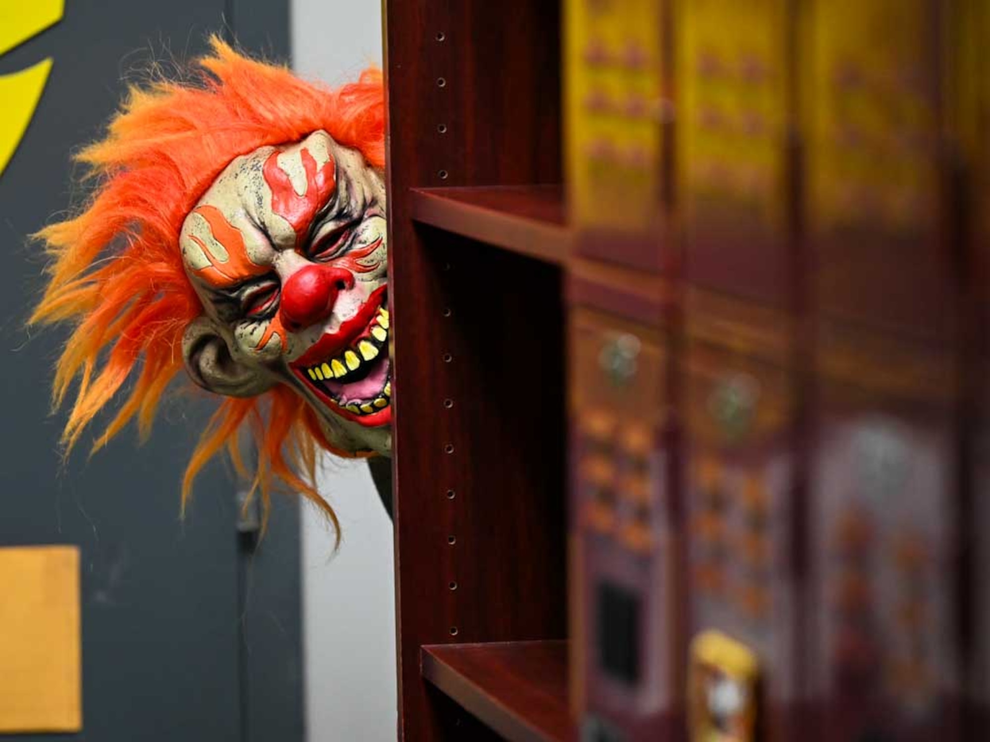 A creepy clown mask adds to the spooky atmosphere during the 552nd Air Control Wing’s Boo Bash at Tinker Air Force Base. The Halloween event featured haunted house elements, Trunk-or-Treat stations, and festive activities for the whole family.
(U.S. Air Force photo by Garrett N. Cole)