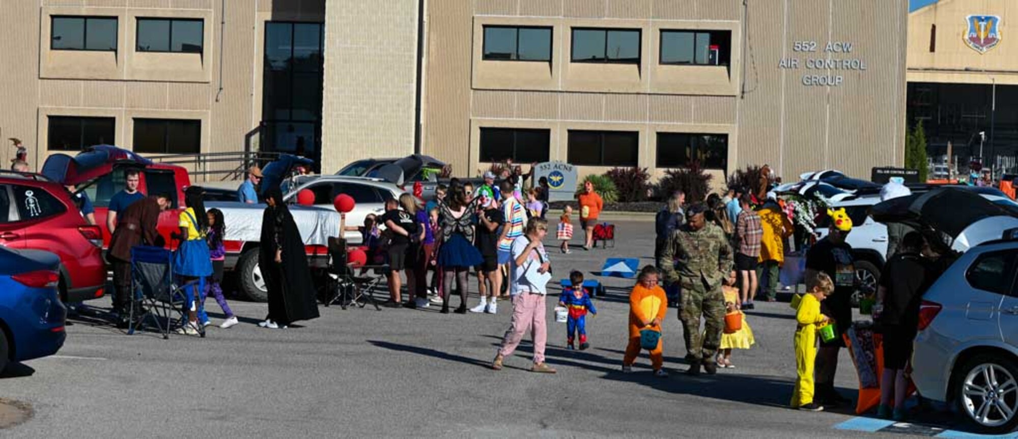 Families gather outside the 552nd Air Control Group for the Trunk-or-Treat portion of the Boo Bash at Tinker Air Force Base. The annual event offered a safe and festive environment for children to enjoy Halloween with the Air Force community.
(U.S. Air Force photo by Garrett N. Cole)