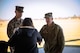 U.S. Army Cyber Center of Excellence Chief of Staff Col. Joel Houk welcomes incoming Marine Detachment Commander Maj. Wesley Nix and his wife after a change of command ceremony at Barton Field on Fort Eisenhower, Ga.