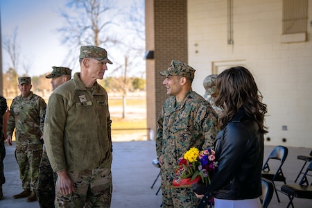 U.S. Army Cyber Center of Excellence Deputy Commanding General talks with outgoing Marine Detachment Commander Maj. Michael Troncoso during a change of command ceremony where Troncoso relinquished command to Maj. Wesley Nix on January 16, 2025, at Barton Field on Fort Eisenhower, Ga.