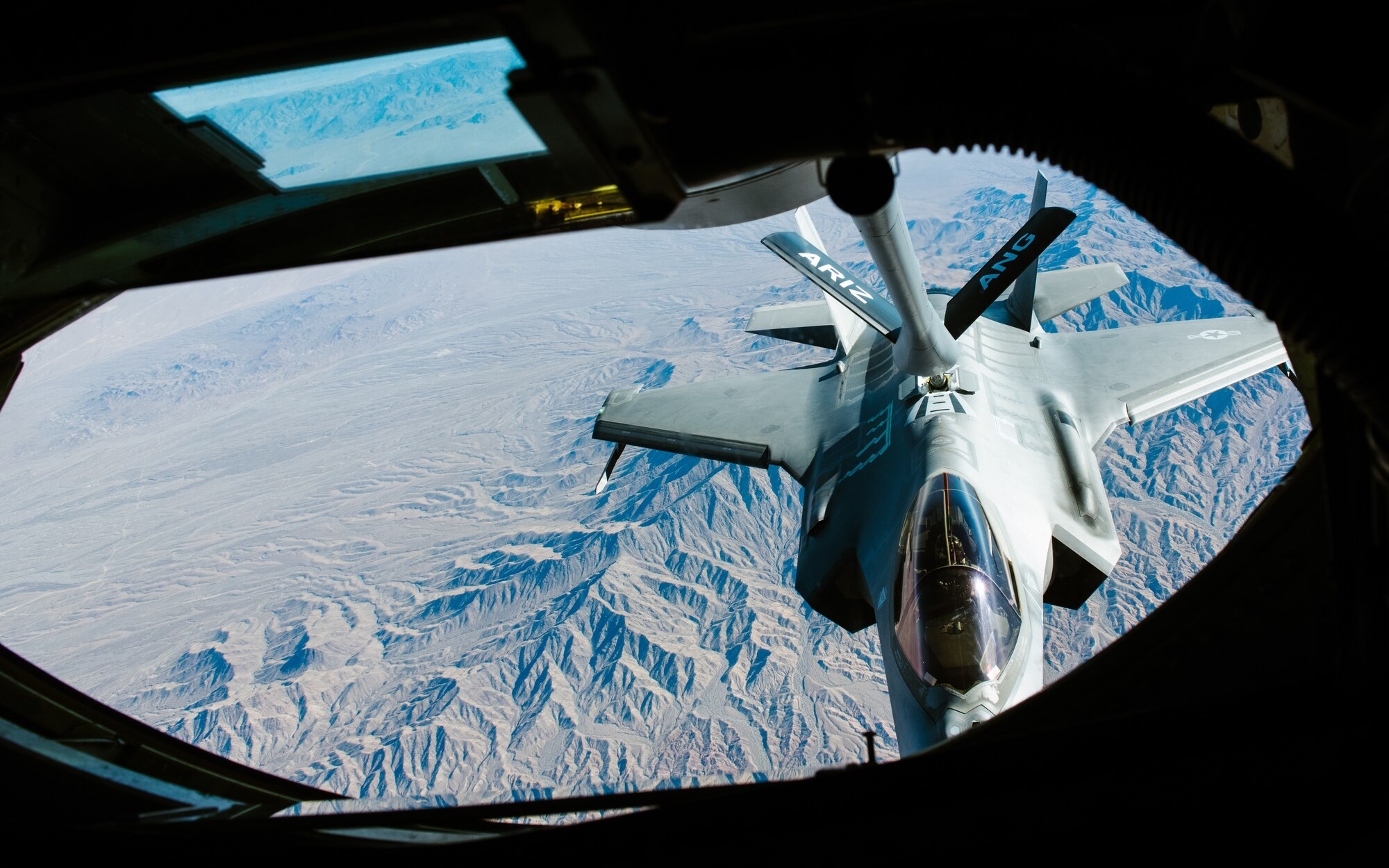 A U.S. Air Force F-35 Lightning II receives fuel from a U.S. Air Force KC-135 Stratotanker.