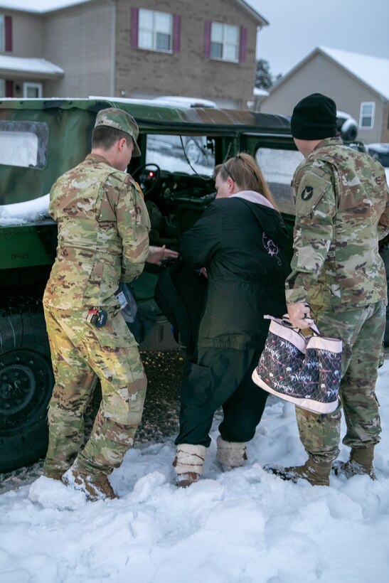 Soldiers from the Kentucky Army National Guard’s 63rd Theater Aviation Brigade respond to requests to transport critical and essential employees who could not make it to their jobs near Frankfort, Kentucky on January 6, 2025.