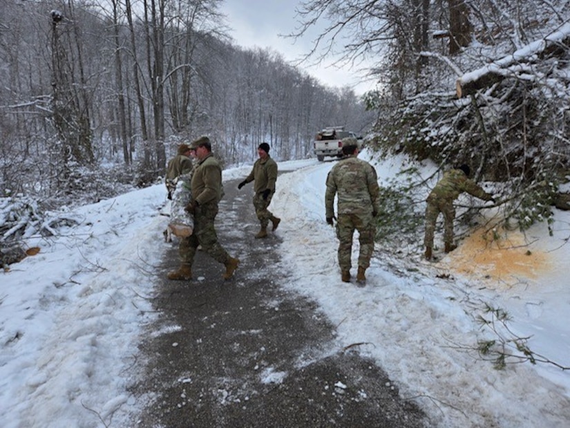 Members of a toss teams from the 149th Engineer Vertical Construction Company, 149th Maneuver Enhancement Brigade assist in the clearance of essential roadways in Morgan County, Ky., Jan.9 2025.