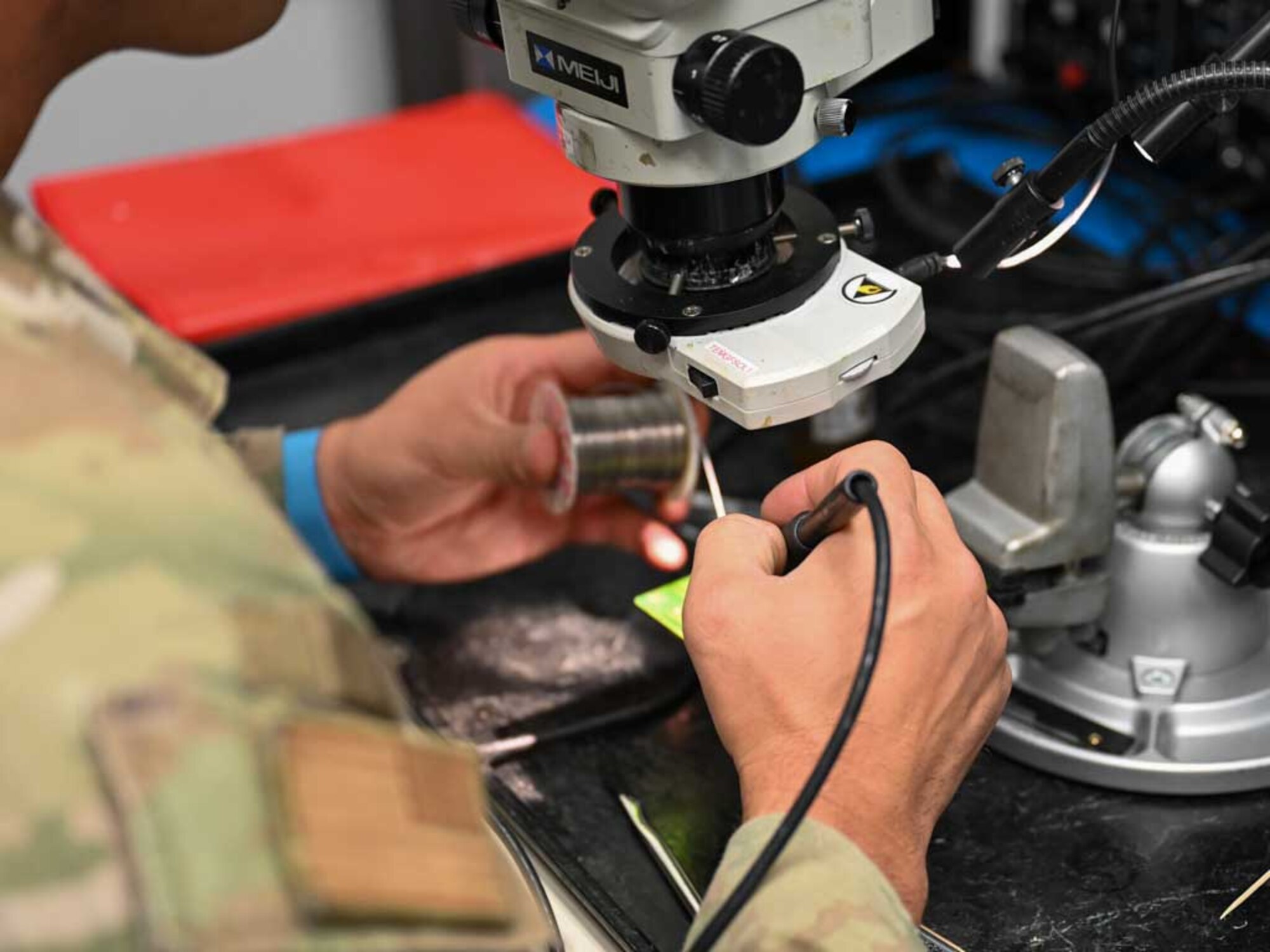 A technician from the 552nd Air Control Wing’s Air Force Repair Enhancement Program (AFREP) performs precision soldering on a circuit card for the E-3 Sentry AWACS. This intricate work is a key part of AFREP’s mission to repair and return essential components to service, ensuring operational readiness and cost savings.
(U.S. Air Force Photo by Garrett N. Cole)