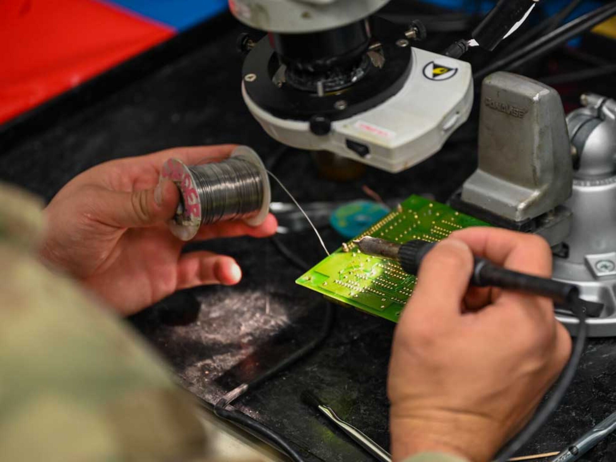 A technician from the 552nd Air Control Wing’s Air Force Repair Enhancement Program (AFREP) performs precision soldering on a circuit card for the E-3 Sentry AWACS. This intricate work is a key part of AFREP’s mission to repair and return essential components to service, ensuring operational readiness and cost savings.

(U.S. Air Force Photo by Garrett N. Cole)