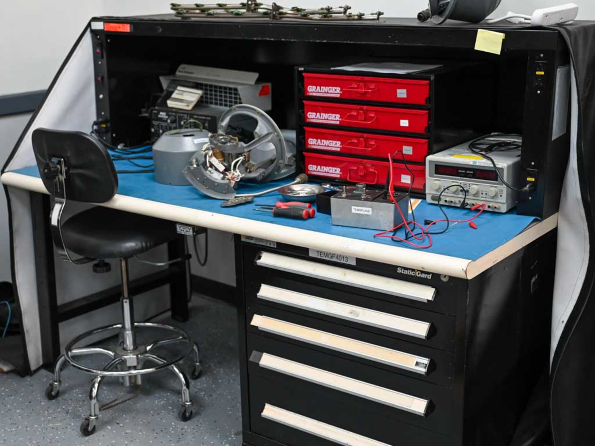 A workstation at the 552nd Air Control Wing’s Air Force Repair Enhancement Program (AFREP) facility showcases tools and equipment used to repair and restore critical E-3 Sentry AWACS components. The program's efforts are essential to overcoming supply chain challenges and maintaining mission readiness.