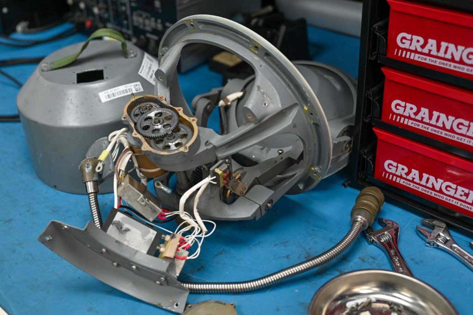 A disassembled mechanical component from the E-3 Sentry AWACS aircraft awaits inspection and repair at the 552nd Air Control Wing’s Air Force Repair Enhancement Program (AFREP) facility. AFREP technicians specialize in restoring vital parts like these, reducing costs and ensuring the fleet's readiness amidst supply shortages.