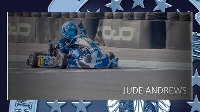 A young boy races a motor kart during a competition.