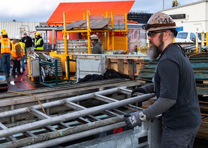A TRFB team member works at Delta Pier.