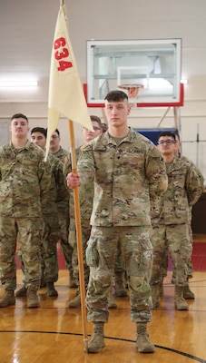 Spc. Patrick Lopez holds the unit guidon during the mobilization ceremony for the Illinois Army National Guard's 634th Brigade Support Battalion Forward Logistics Element, Jan. 20