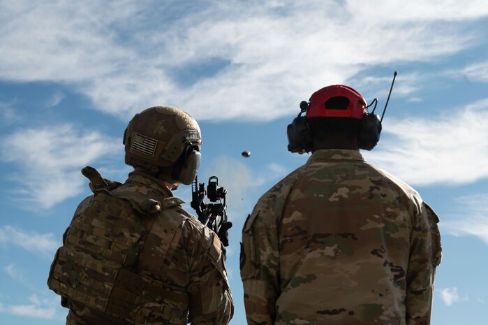 U.S. Air Force Senior Airman Caleb Mantooth, Internal Security Response Team, left, and Senior Airman Stephen Johnson, Combat Arms Training and Maintenance instructor, both assigned to 9th Security Forces Squadron (SFS) participate in target engagement drills at Beale Air Force Base, California, Jan. 14, 2025.