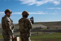 U.S. Air Force Airman 1st Class Colin Goyette, left, and Airman 1st Class Victor Gomez, 9th Security Forces Squadron (SFS), installation entry controllers, participate in mobile target training at Beale Air Force Base, California, Jan. 14, 2025.