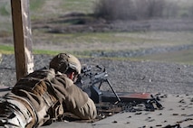 U.S. Air Force Senior Airman Gabriel Menendez, 9th Security Forces Squadron (SFS), installation entry controller, fires an M249 light machine gun at artificial intelligence-driven robots at Beale Air Force Base, California, Jan. 14, 2025.