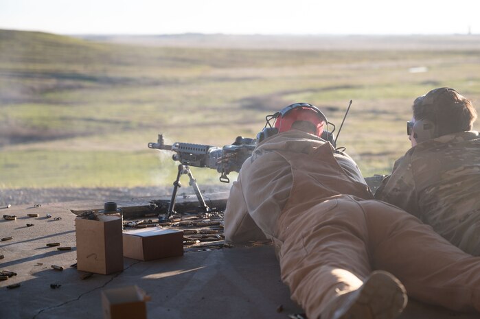 U.S. Air Force Senior Airman Brandon Goetz, 9th Security Forces Squadron (SFS) Combat Arms Training and Maintenance instructor, fires an M240 bravo machine gun at mobile robot targets at Beale Air Force Base, California, Jan. 14, 2025.