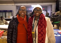 Renee Bangora (left), State Family Program Director, and Nicolette Stout, State Family Program Specialist, at the D.C. Armory in Washington, D.C., on Jan. 15, 2025. Soldiers from the Joint Task Force District of Columbia are deployed in support of the 60th Presidential Inauguration. Approximately 8,000 National Guard service members from approximately 40 states and territories comprise JTF-DC to support the 60th Presidential Inauguration, continuing a legacy that began in 1789 when their predecessors escorted George Washington to the first inauguration. At the request of civil authorities, these National Guard service members provide critical support such as crowd management, traffic control points, CBRN response, civil disturbance response, and sustainment operations. Their expertise and seamless collaboration with interagency partners help ensure a safe and peaceful transition of power during this historic event.