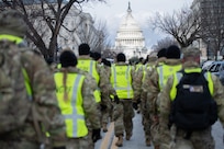 Idaho National Guard Soldiers and Airmen attached to Joint Task Force District of Columbia (JTF-DC) walk to their assigned crowd control points in Washington, D.C., Jan. 20, 2025. Approximately 8,000 National Guard service members from approximately 40 states, territories, and the District of Columbia comprise JTF-DC to support the 60th Presidential Inauguration, continuing a legacy that began in 1789 when their predecessors escorted George Washington to the first inauguration. At the request of civil authorities, these National Guard service members provide critical support such as crowd management, traffic control points, CBRN response, civil disturbance response, and sustainment operations. Their expertise and seamless collaboration with interagency partners help ensure a safe and peaceful transition of power during this historic event.