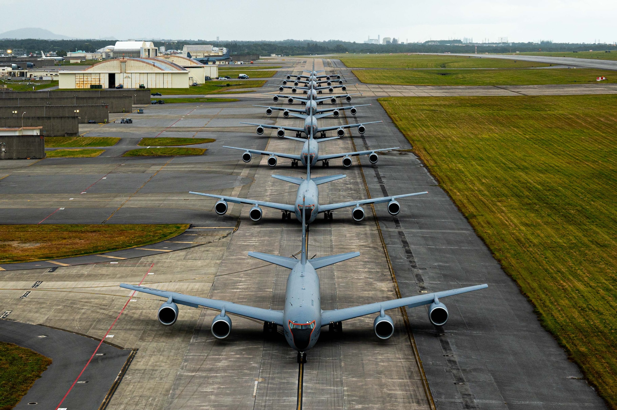 Aircraft line up on a taxiway for an elephant walk.