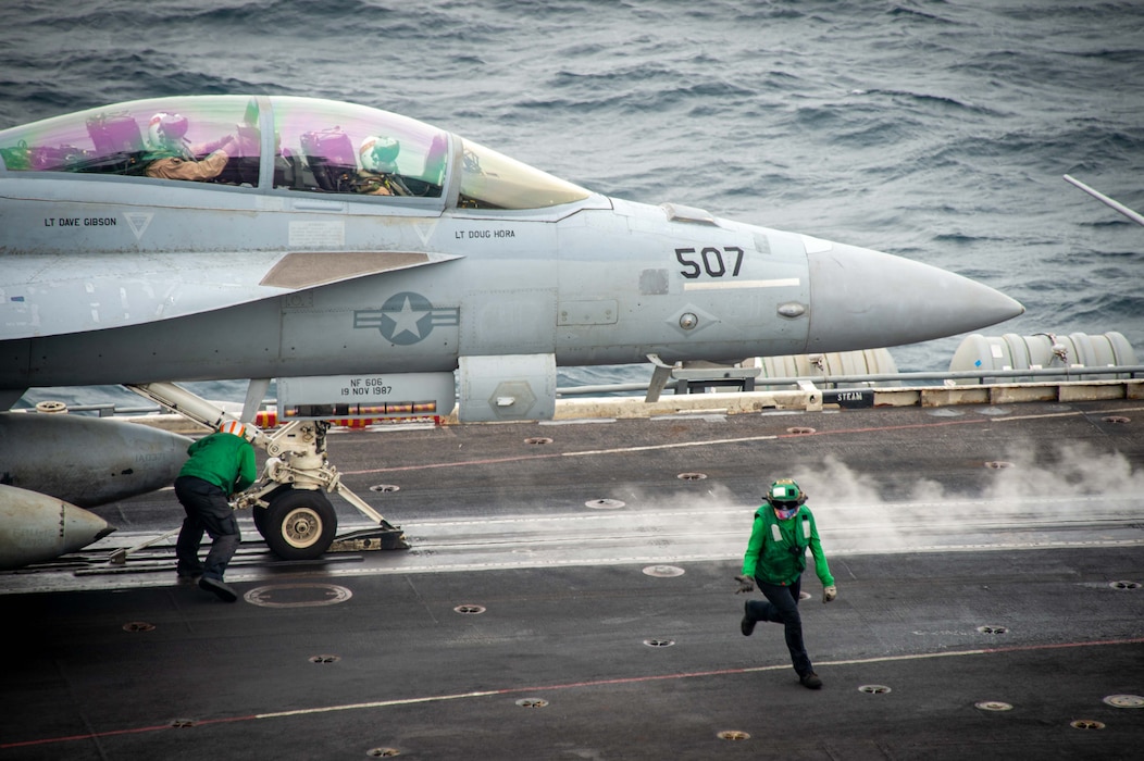 Sailors prepare to launch an EA-18G Growler from VAQ-136 during flight operations aboard USS Carl Vinson (CVN 70)  in the South China Sea.