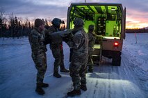 Soldiers assigned to Charlie Company, 25th Brigade Support Battalion, 1st Infantry Brigade Combat Team, 11th Airborne Division, move a simulated casualty into a Field Litter Ambulance as part of a medical evacuation rehearsal ahead of Joint Pacific Multinational Readiness Center 25-02, at the Donnelly Training Area near Fort Greely, Alaska, Jan. 18, 2025.