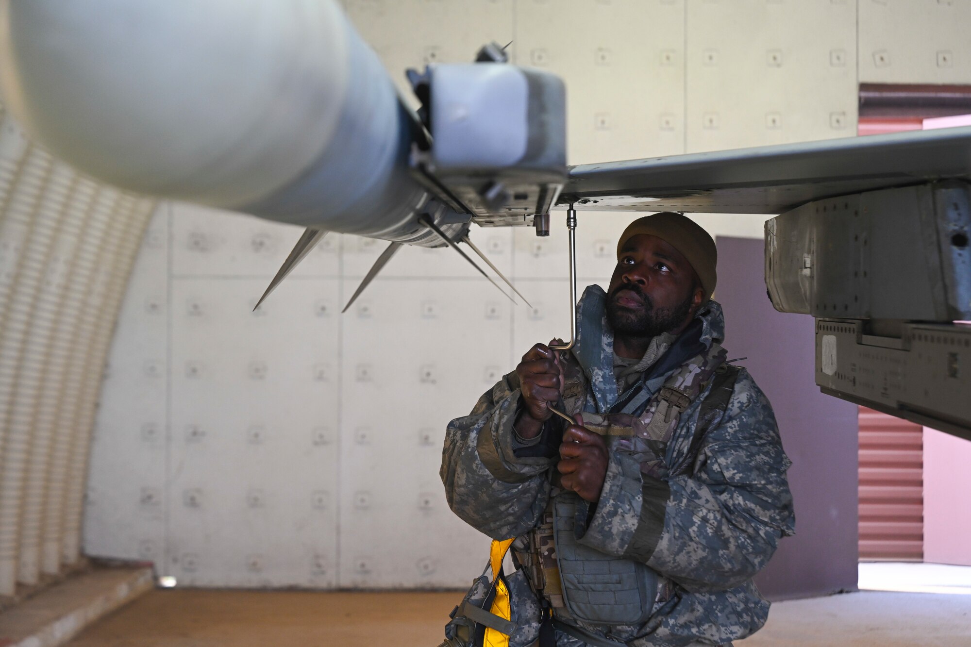 Airman 1st Class Quatavious Cash, 35th Fighter Generation Squadron assistant dedicated crew chief, tightens a wing tip screw on the right wing of an F-16 Fighting Falcon during Beverly Pack 25-1 at Gwangju Air Base, Republic of Korea, Jan. 14, 2025.
