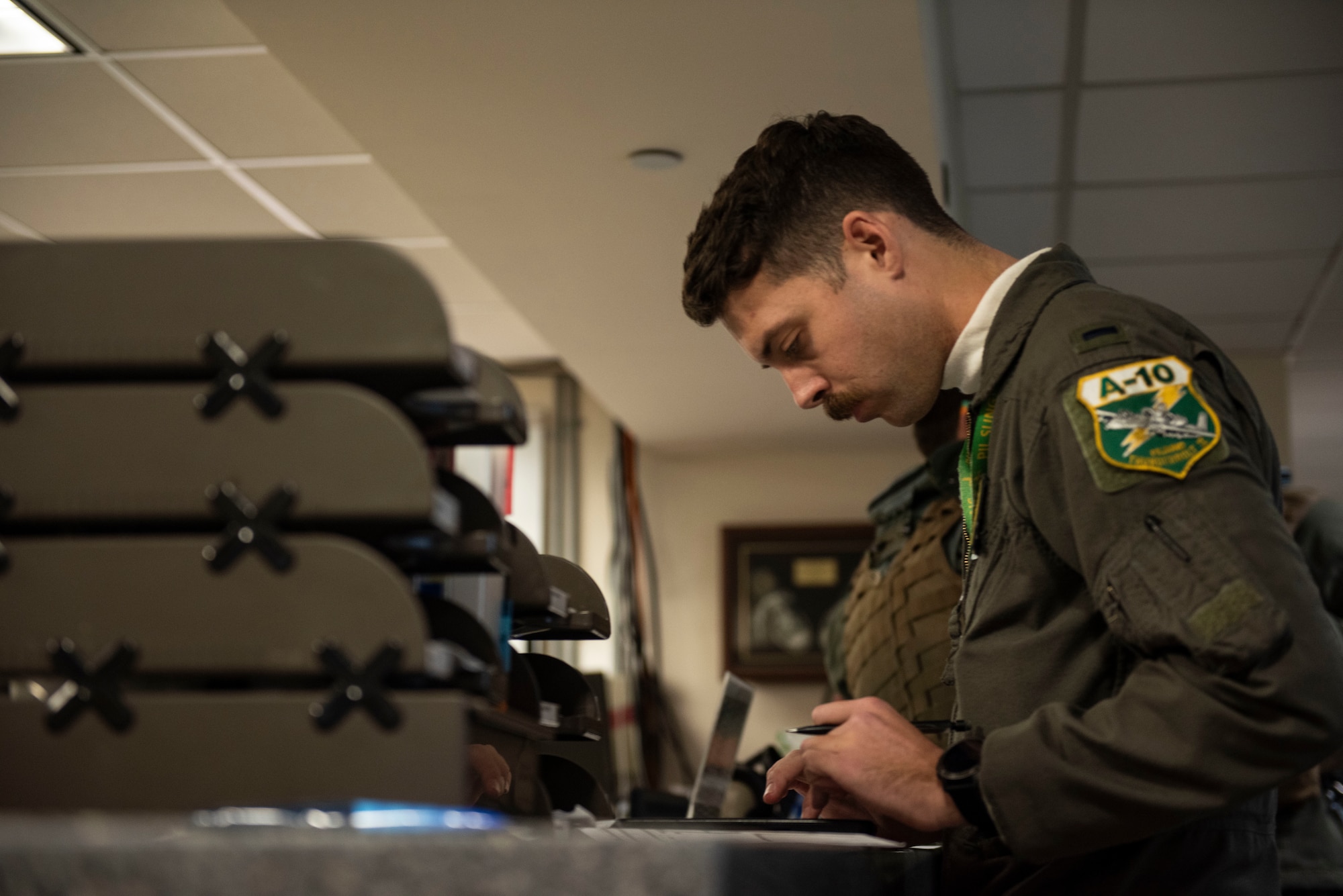 U.S. Air Force 1st Lt. Hunter Nixon, 25th Fighter Squadron A-10 Thunderbolt II pilot, conducts pre-flight planning, at Osan Air Base