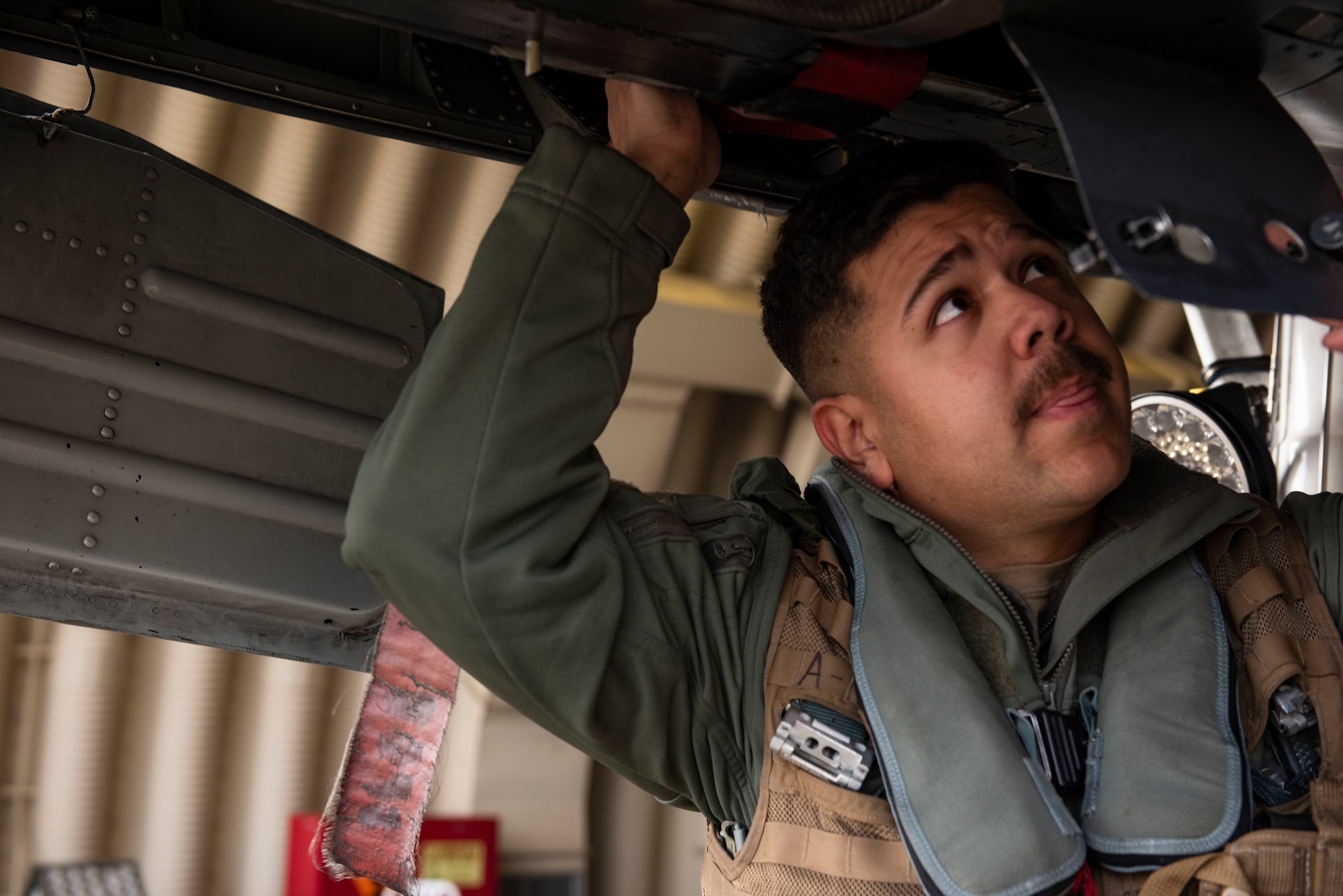 U.S. Air Force Capt. Christian Alvarado, 25th Fighter Squadron A-10 Thunderbolt II pilot, conducts pre-flight checks on his aircraft, at Osan Air Base