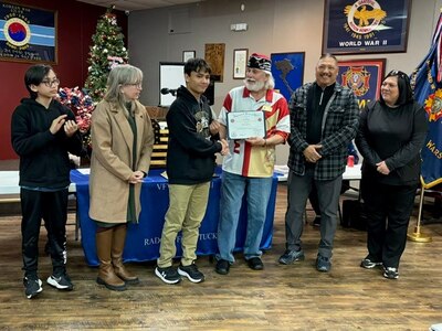 Robert Magalong receives a certificate from VFW Post 10281 to commemorate his selection in the post level Veterans of Foreign Wars Democracy Essay Contest. Each year, nearly 25,000 ninth through 12th grade students from across the country enter to win their share of more than $1 million in educational scholarships and incentives awarded through the program. The national first place winner receives a $35,000 scholarship paid directly to the recipient’s American university, college or vocational/technical school.