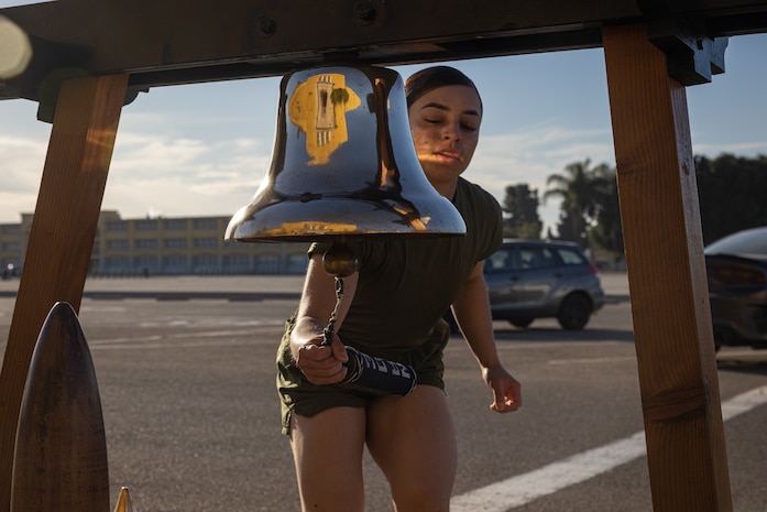 A new U.S. Marine of Lima Company, 3rd Recruit Training Battalion, rings the liberty bell during the company motivational run at Marine Corps Recruit Depot San Diego, California, Jan. 16, 2025. The company motivational run is a three-mile cadence run conducted around the Depot and is the last physical training event the Marines will conduct before they graduate from MCRD San Diego. The event is also the first-time friends and families will see their newly transformed Marines. Most ready when our nation is least ready, we train Marines to defeat the challengers, obstacles, and potential adversaries that hinder our nation’s progress and threaten our peace and security. (U.S. Marine Corps photo by Lance Cpl. Jacob Hutchinson)